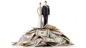 Heap of money with wedding cake topper